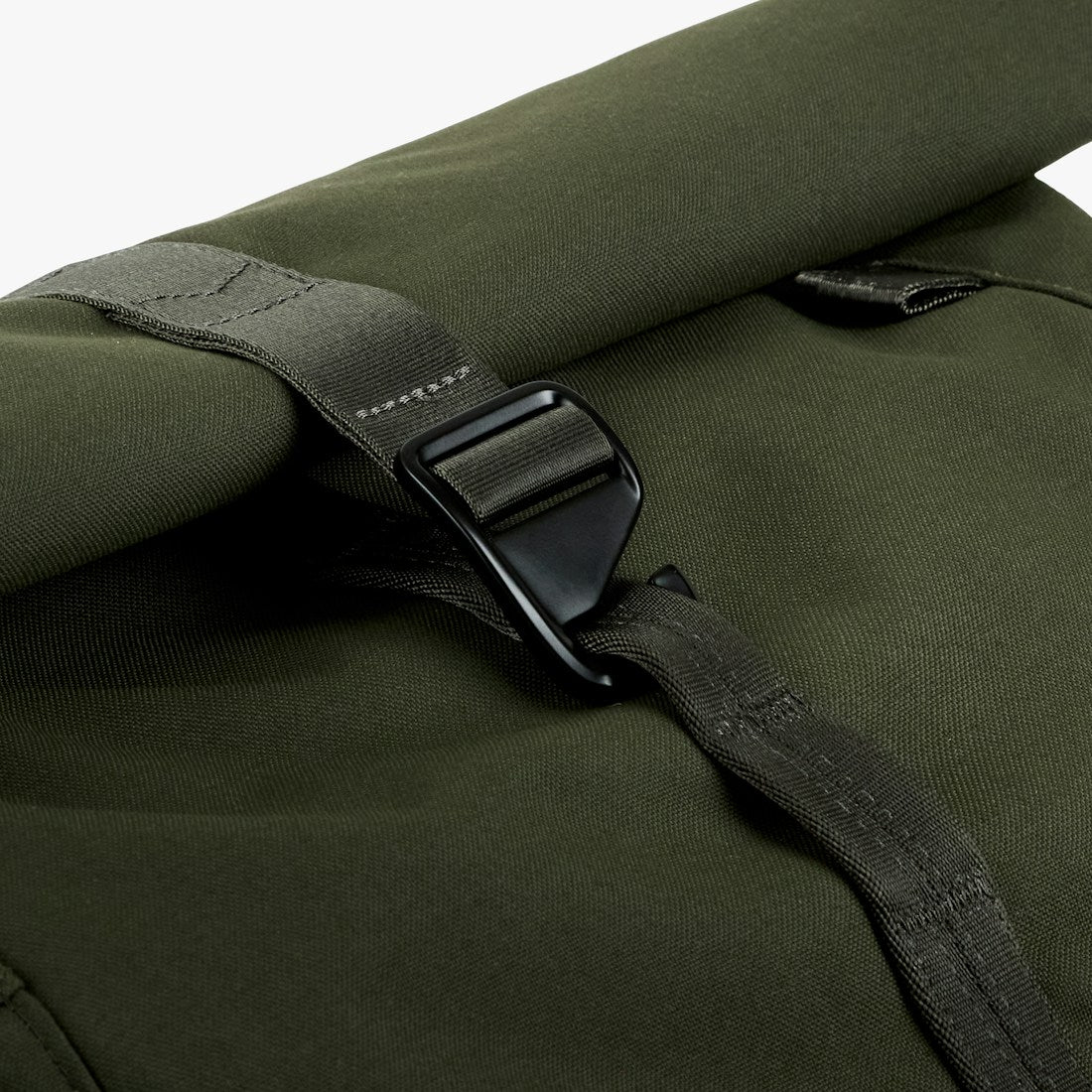 Bellroy Classic Rolltop commuter backpack in Olive, close-up of roll-top metal hook closure - The Simple Man