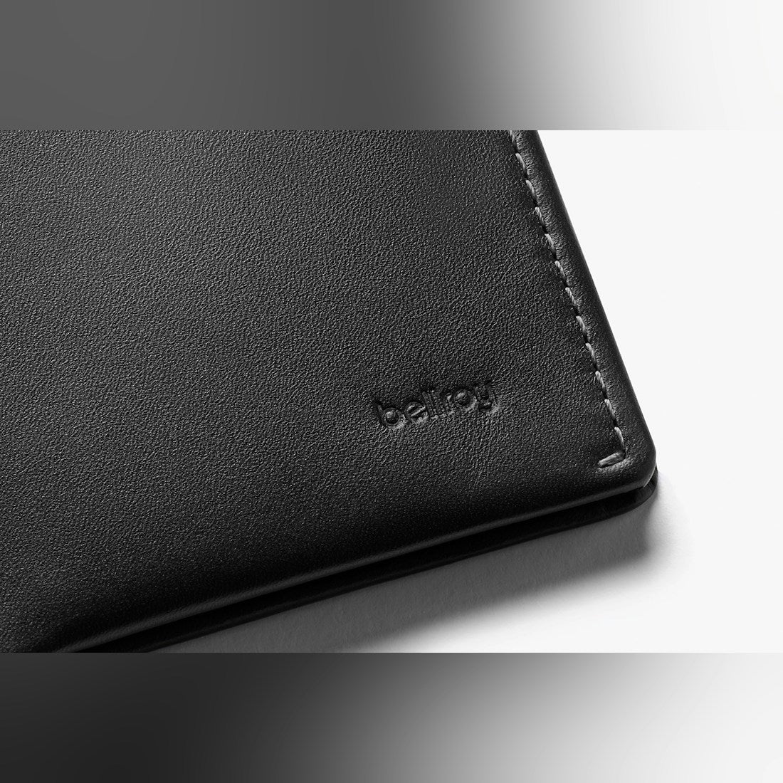 Bellroy Note Sleeve RFID leather wallet in Black, close-up of leather with embossed logo - The Simple Man