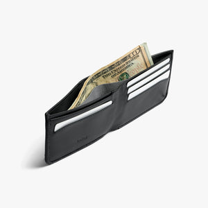 Bellroy Hide & Seek RFID leather wallet in Black, open at an angle with cash and card slots - The Simple Man