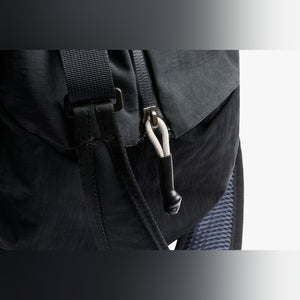 Bellroy Lite Duffel in Black, close-up of the strap hardware - The Simple Man