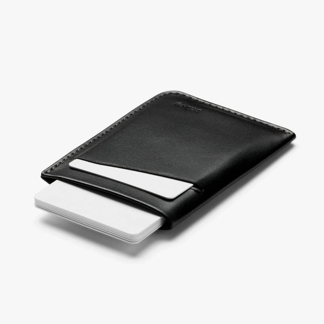 Bellroy Card Sleeve wallet in Black, side view with a card tucked in the front slot - The Simple Man