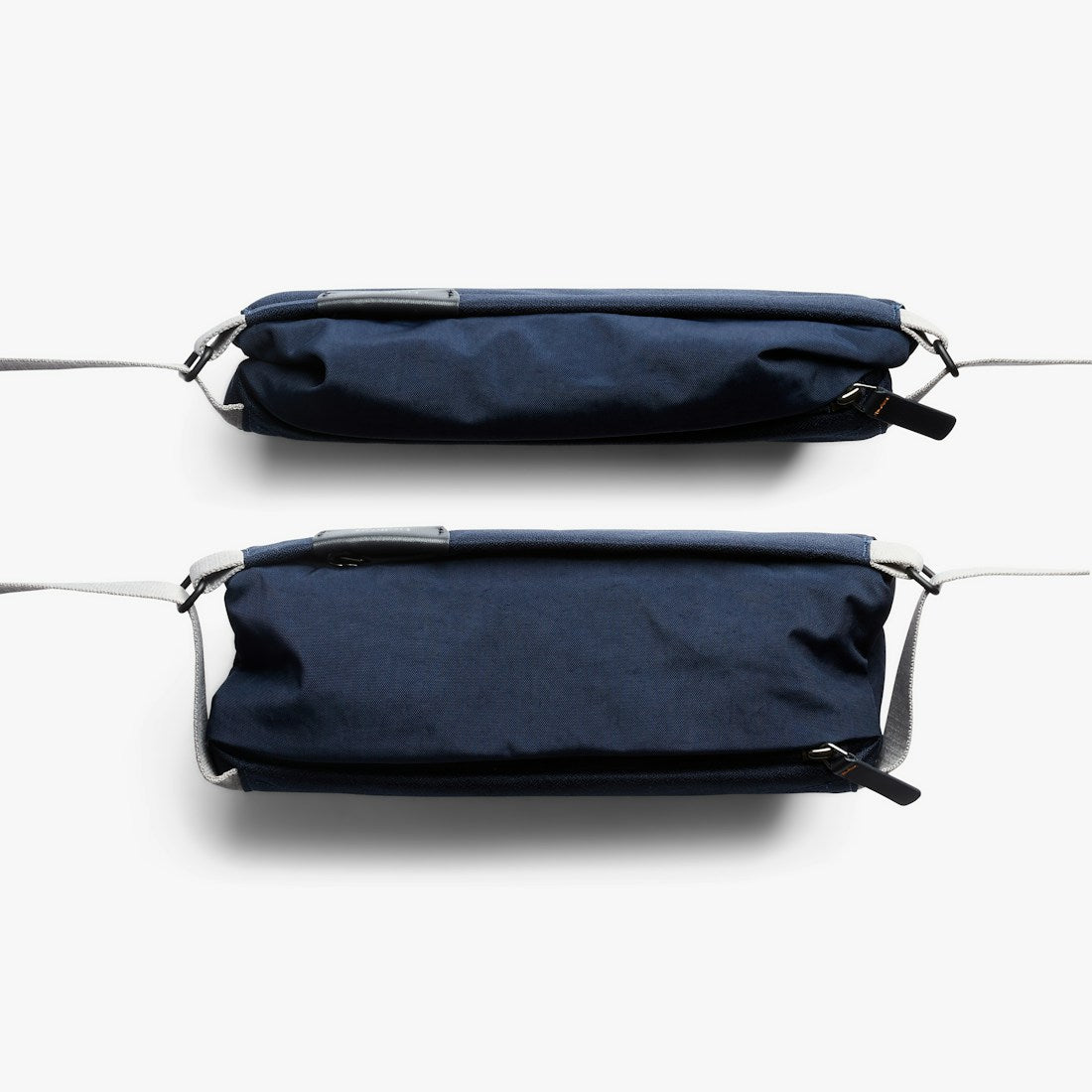 Bellroy Sling Mini sling bag in Navy, front and back views - The Simple Man