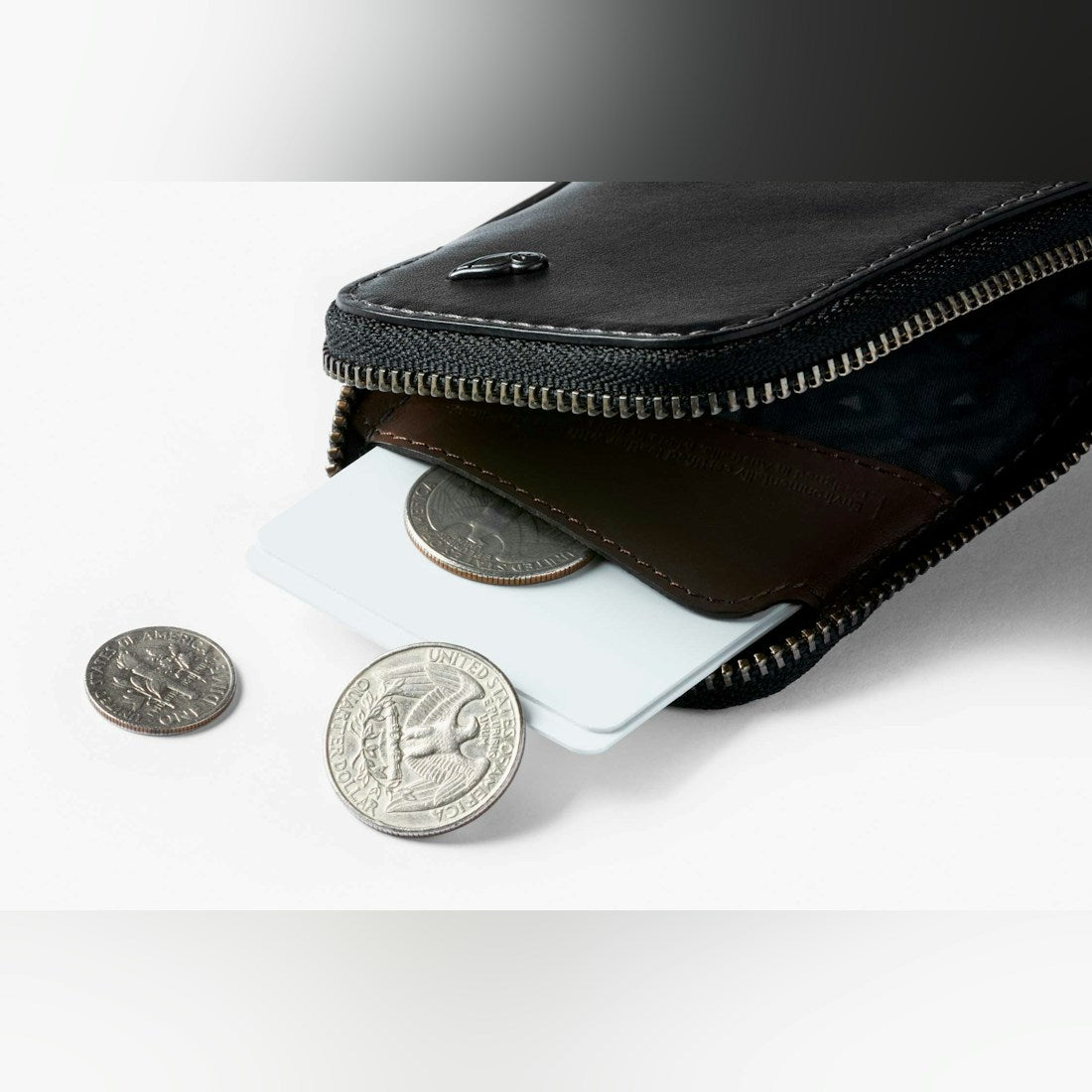 Bellroy Card Pocket wallet in Black, close-up with coins and a card - The Simple Man