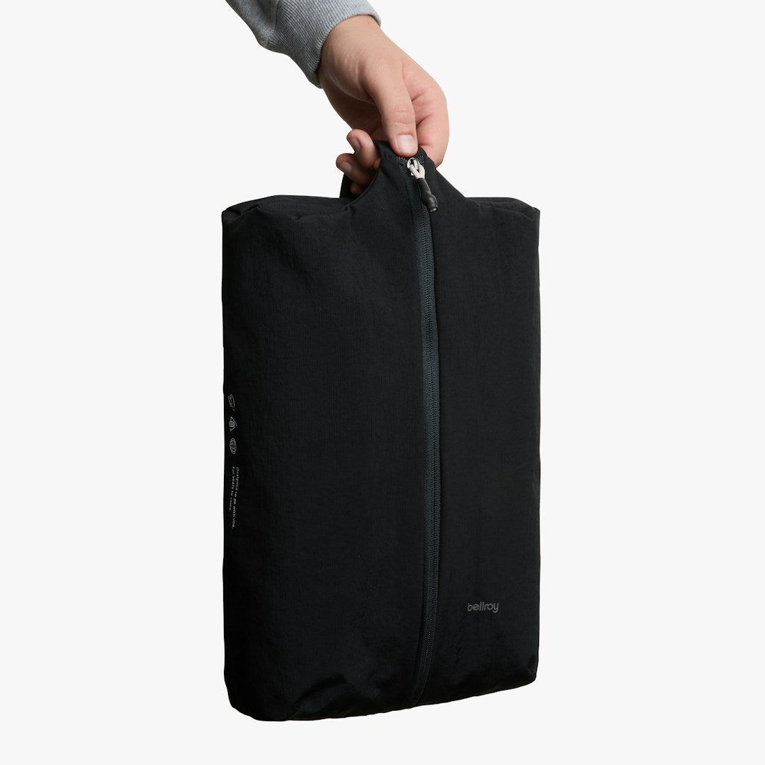 Bellroy Lite Packing Caddy 10L in Black, held by the handle, upright - The Simple Man