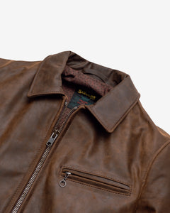 Close-up of the collar, zipper and diagonal zippered chest pocket on the brown cowhide trucker jacket - The Simple Man