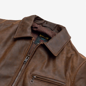 Close-up of the collar, zipper and diagonal zippered chest pocket on the brown cowhide trucker jacket - The Simple Man