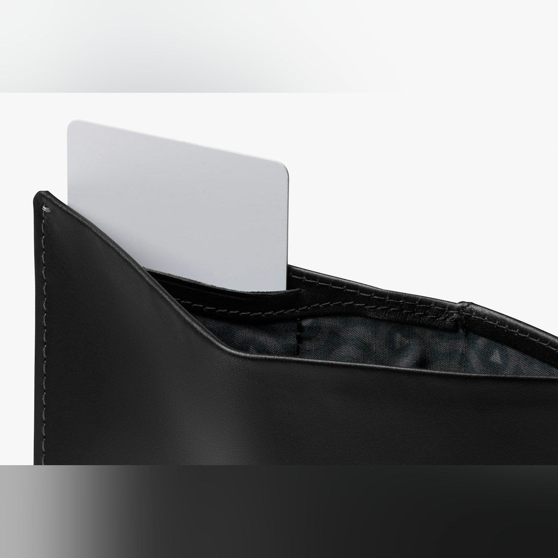 Bellroy Note Sleeve RFID leather wallet in Black, close-up of a card in the inside pocket - The Simple Man