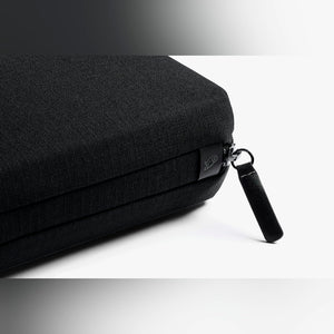 Bellroy Tech Kit cable organizer in Black, close-up of black fabric and zipper pull - The Simple Man