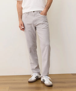 Model wearing light grey Flex Terry slim straight pants styled casually with sneakers