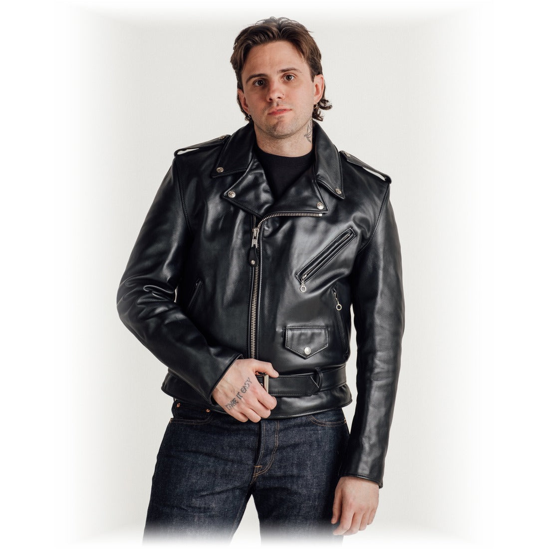 Front view on model of the black steerhide Perfecto motorcycle jacket with belt and coin pocket - The Simple Man