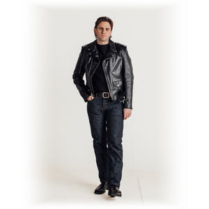 Full length view of a man wearing the black steerhide Perfecto motorcycle jacket with jeans and boots - The Simple Man