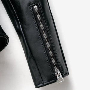 Close-up of the zippered sleeve cuff on the black Perfecto steerhide jacket - The Simple Man