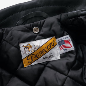 Inside of the black Perfecto jacket showing the Made in USA label and quilted nylon lining - The Simple Man