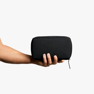 Bellroy Tech Kit cable organizer in Black, held in a hand to show size - The Simple Man