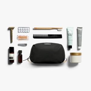 Bellroy Toiletry Kit in Black, flat lay with grooming items - The Simple Man
