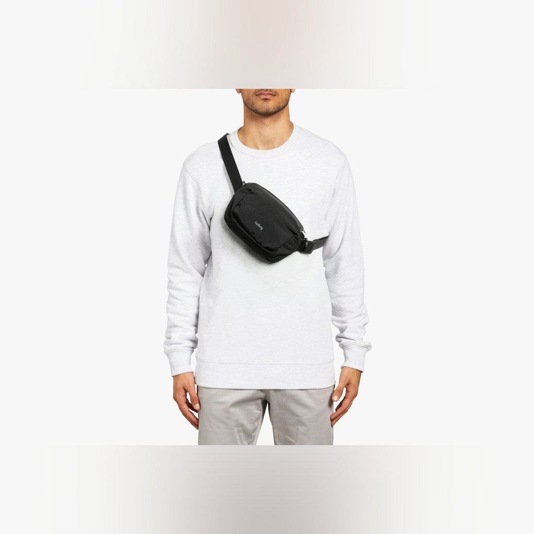 Bellroy Lite Belt Bag in Black, worn at the waist - The Simple Man