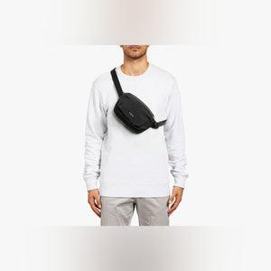 Bellroy Lite Belt Bag in Black, worn at the waist - The Simple Man