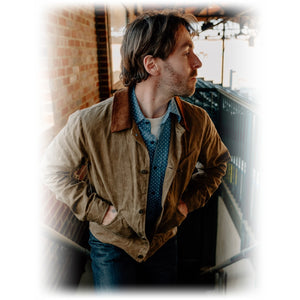 Side view on model of the brown waxed cotton mechanic jacket with corduroy collar - The Simple Man