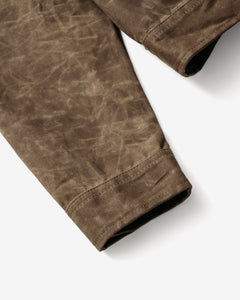 Close-up of the sleeve cuff on the brown waxed cotton mechanic jacket - The Simple Man