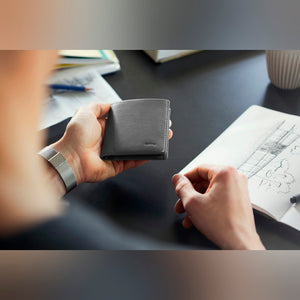 Bellroy Note Sleeve RFID leather wallet in Black, held in hands - The Simple Man