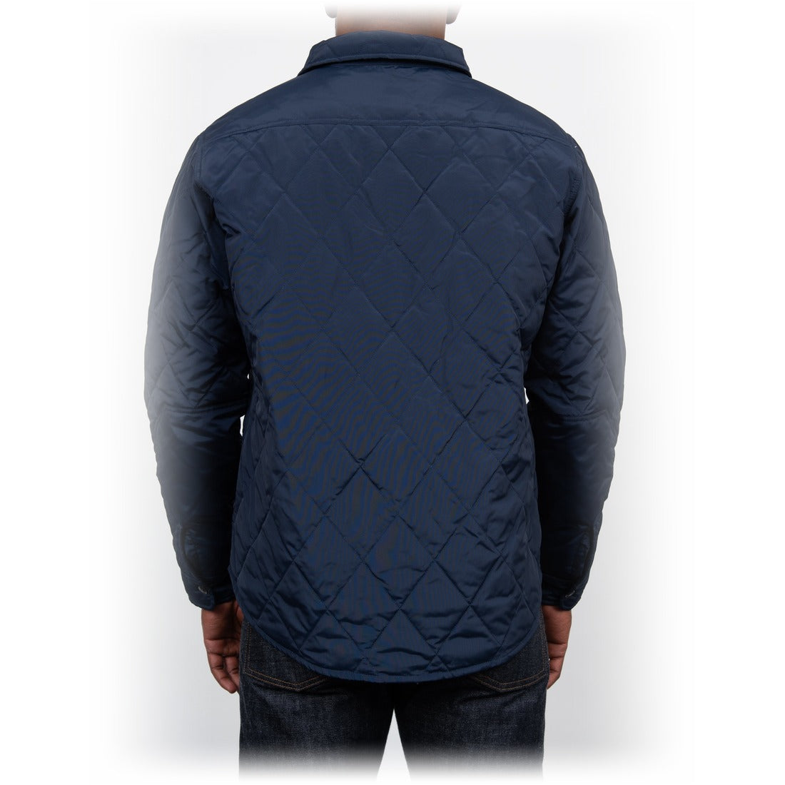 Back view on model of the navy quilted shirt jacket - The Simple Man