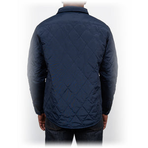 Back view on model of the navy quilted shirt jacket - The Simple Man