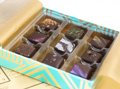 Mayana 9-piece artisan chocolate box open with assorted hand-painted bonbons from The Simple Man