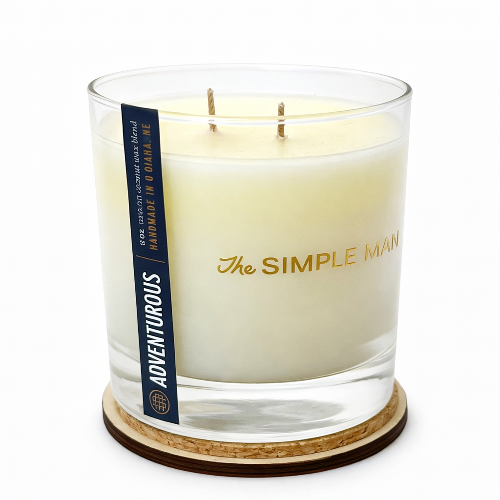 Candle with 'The Simple Man' branding on a white background - Adventurous Lid off