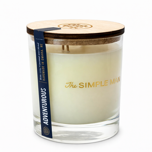 Candle with wooden lid and 'The Simple Man' branding on a white background - Adventurous Lid on