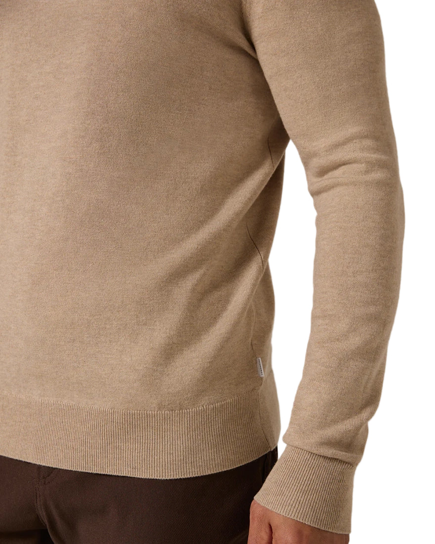 Close-up of Alcott Crewneck Sweater in tan showing double-knit jacquard texture and soft ribbed cuffs
