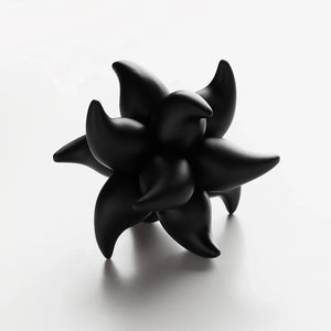 Craighill Andromeda Puzzle held in hand showing scale and dense aluminum construction