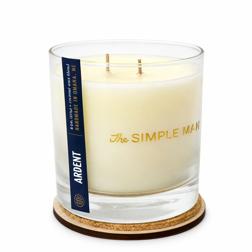 Candle in a glass jar with cork base, featuring 'The Simple Man' branding. - Ardent with lid off