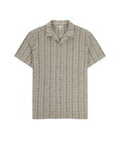Tan short sleeve knit button down shirt with camp collar and subtle jacquard pattern, displayed flat on white background.