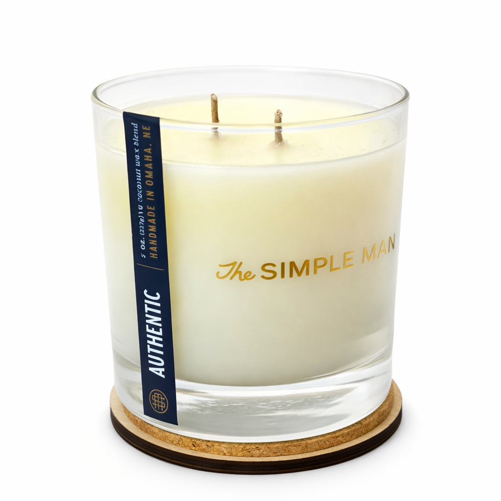 Candle with 'The Simple Man' branding on a white background - Authentic with lid off