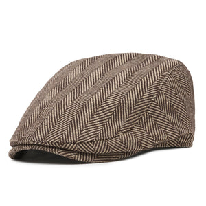 Side view of single-panel brown herringbone flat cap