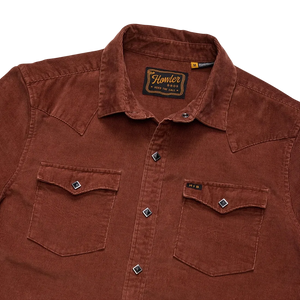 Close-up of diamond pearl snap buttons and chest pockets on the Mink Brown Banning Corduroy Snapshirt showing the Howler Bros label -- The Simple Man