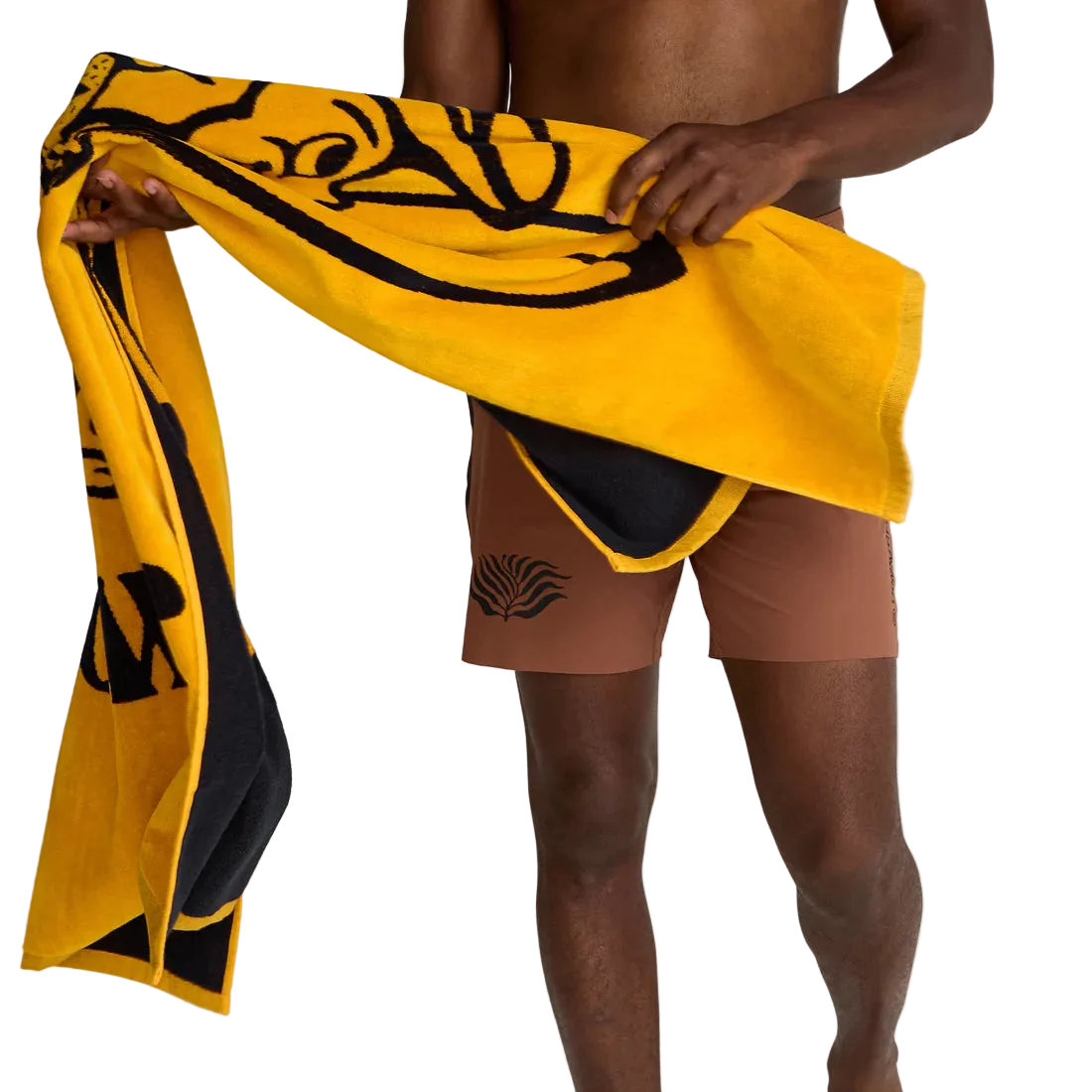 Man holding Howler Bros El Mono beach towel in dijon yellow and black – oversized 100% cotton 34x60 inch beach towel summer lifestyle