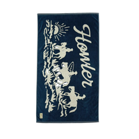 Howler Bros Posse Beach Towel flat lay midnight navy – 100% cotton 34x60 inch oversized beach towel cowboy surfer sun graphic Howler Paradise label