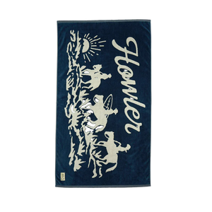 Howler Bros Posse Beach Towel flat lay midnight navy – 100% cotton 34x60 inch oversized beach towel cowboy surfer sun graphic Howler Paradise label