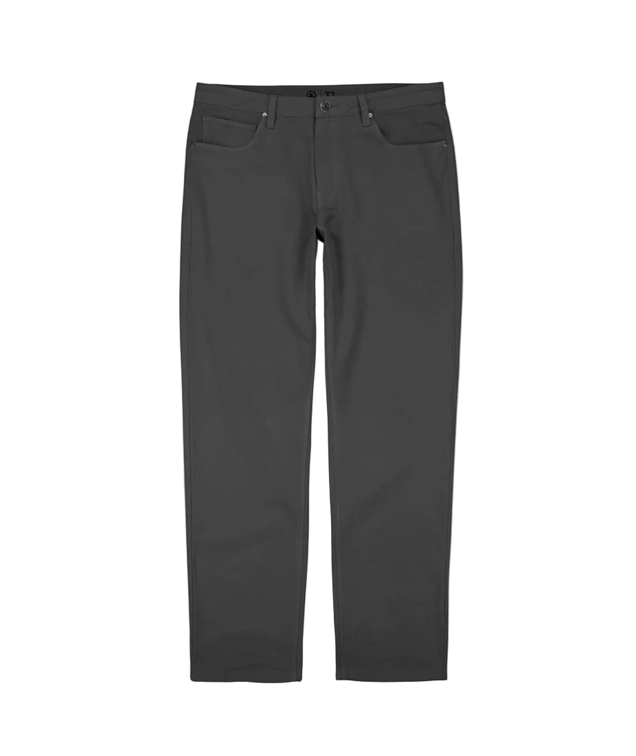 Flat lay of men's Bedrock Pant in charcoal – durable cotton-spandex work pants from The Simple Man, featuring reinforced rivets and denim-style pockets