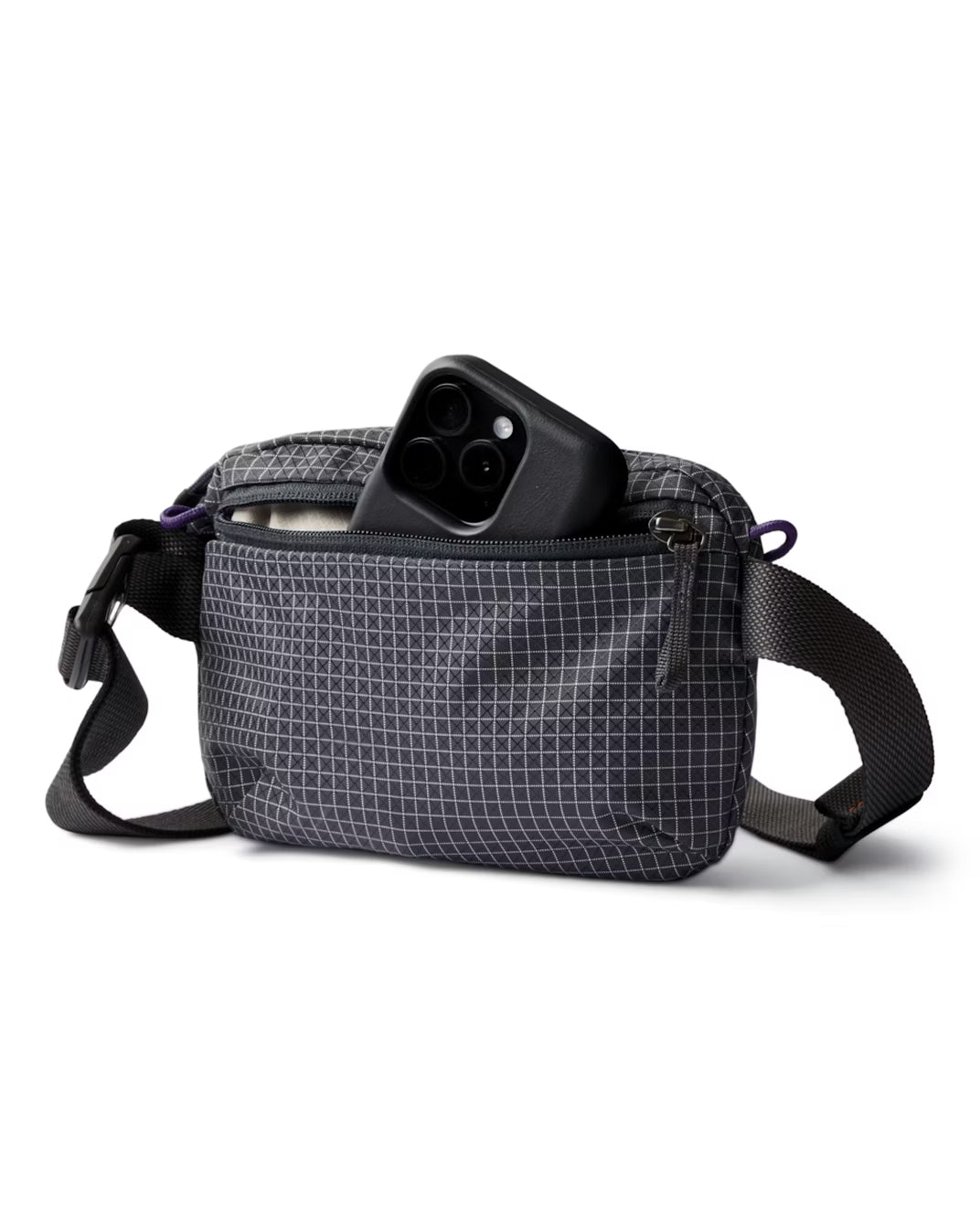 Interior of Bellroy Lite Belt Bag in Arcade Grey showing phone sleeve and key clip