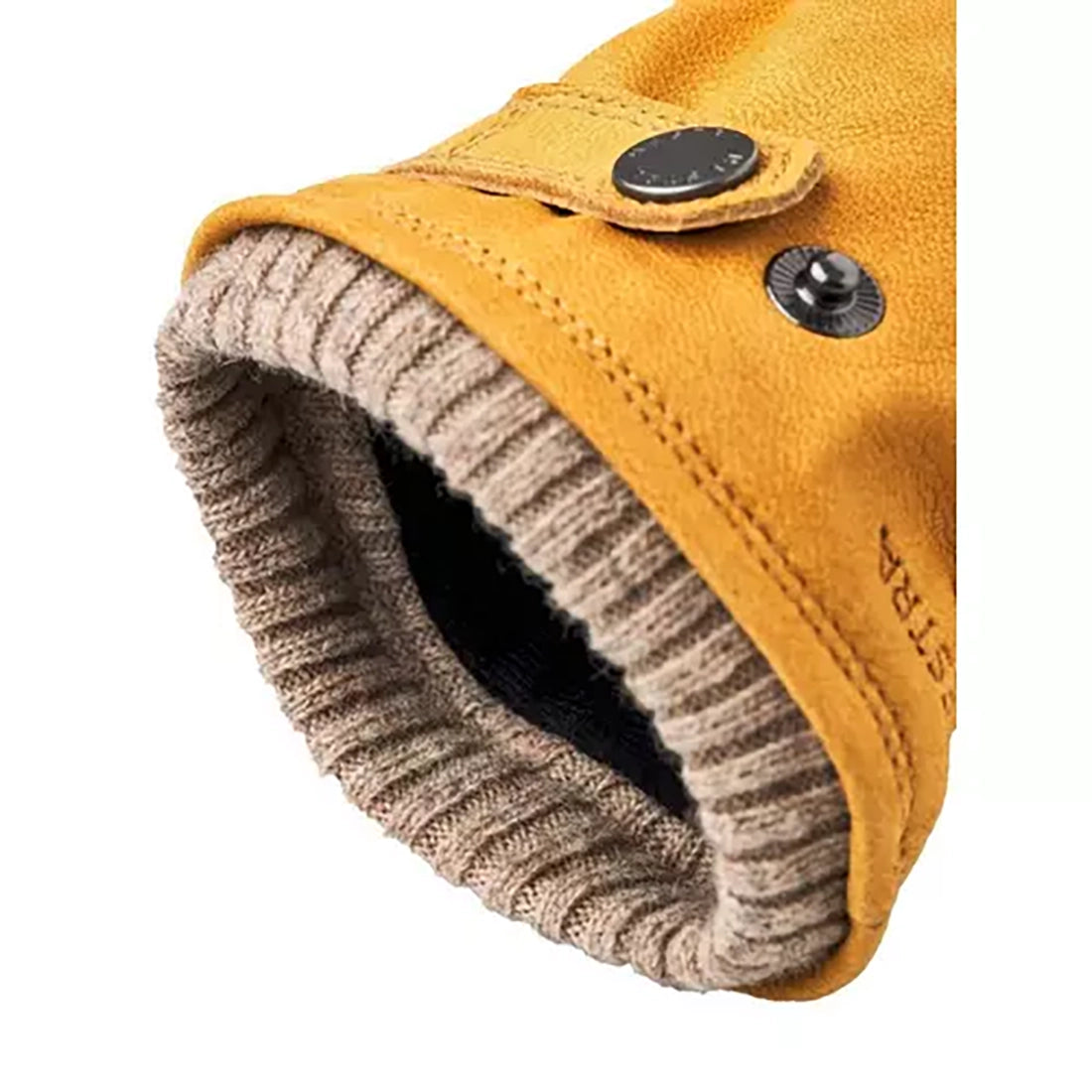 Backhand view of Bergvik tan leather glove showing adjustable wrist strap and ribbed wool cuff – men’s winter glove by The Simple Man