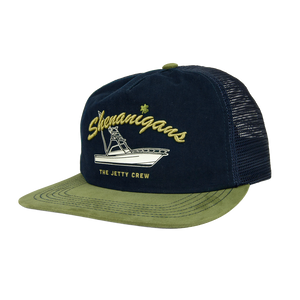 Navy trucker hat with olive green bill and embroidered Shenanigans boat graphic, Boat Crew Hat front angled view - The Simple Man