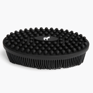 Black dual-sided silicone body scrub brush, three-quarter view