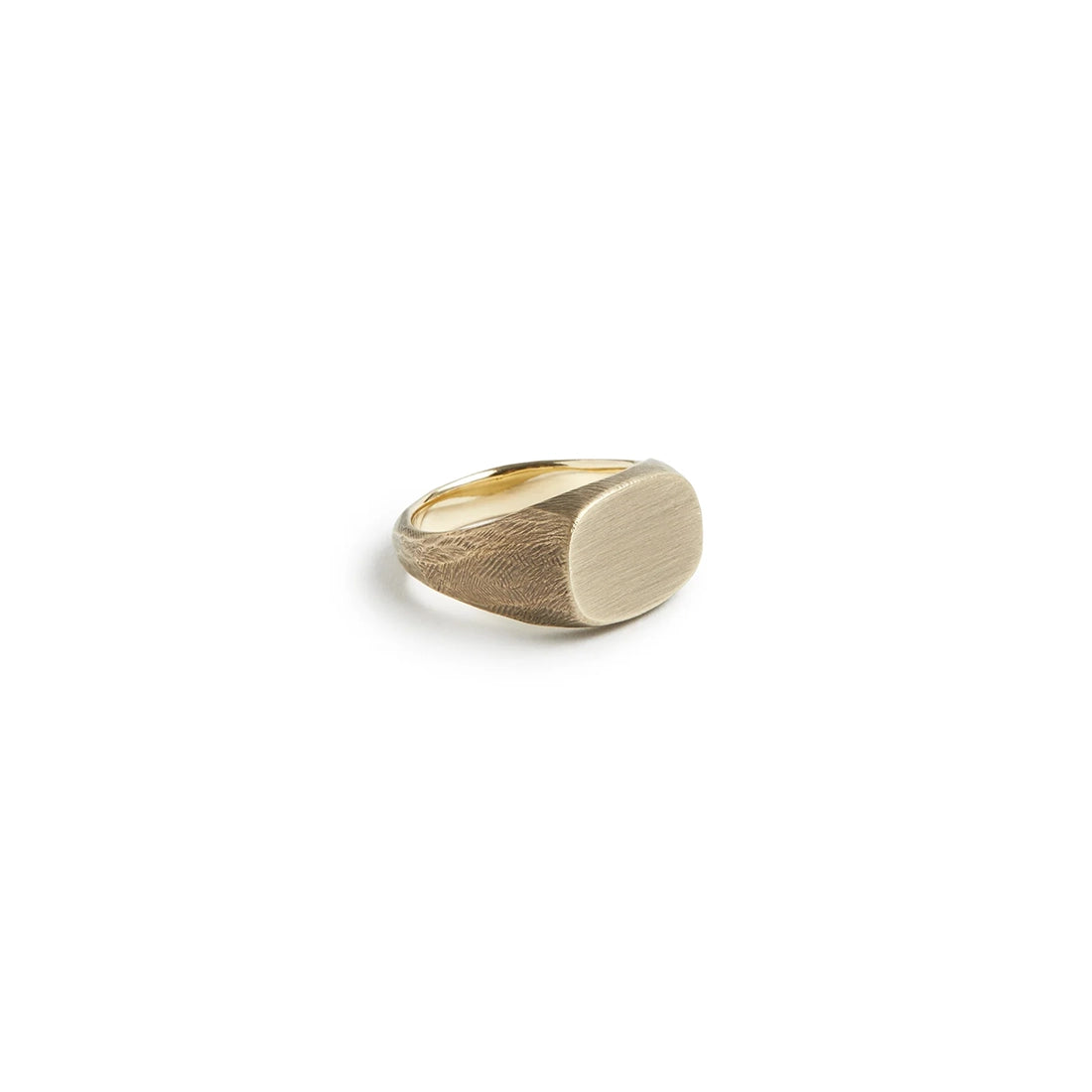Solid brass signet ring with brushed oval face and visible maker’s tool marks – Studebaker Metals at The Simple Man