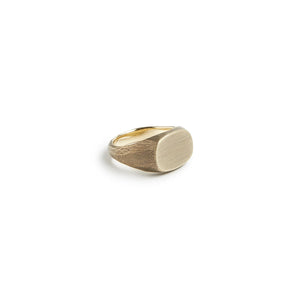 Solid brass signet ring with brushed oval face and visible maker’s tool marks – Studebaker Metals at The Simple Man
