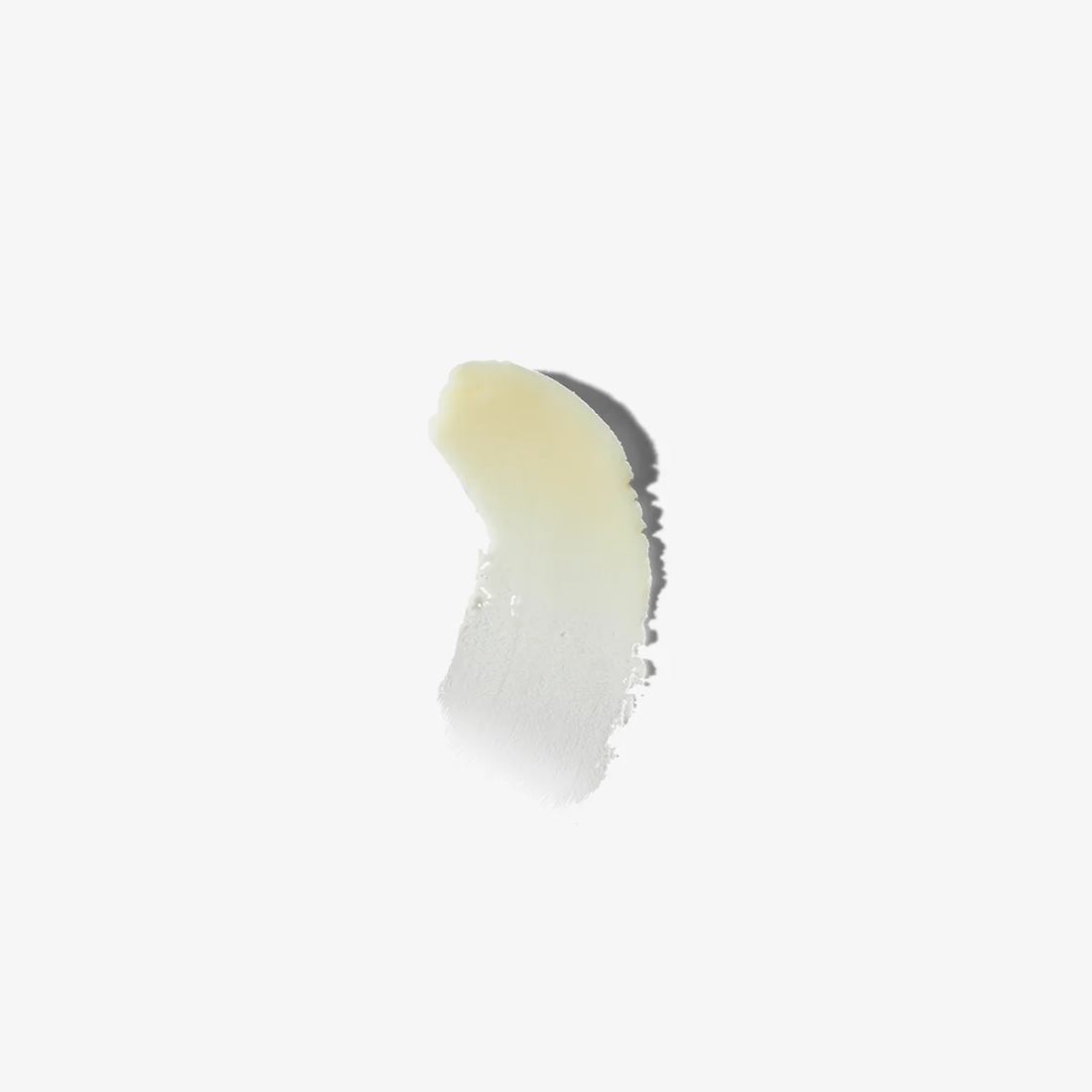 Swipe of pale cream beard balm smeared across a white background, showing its smooth texture