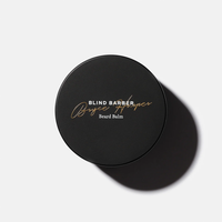 Top view of the black Bryce Harper Beard Balm jar lid with gold script lettering