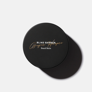 Top view of the black Bryce Harper Beard Balm jar lid with gold script lettering