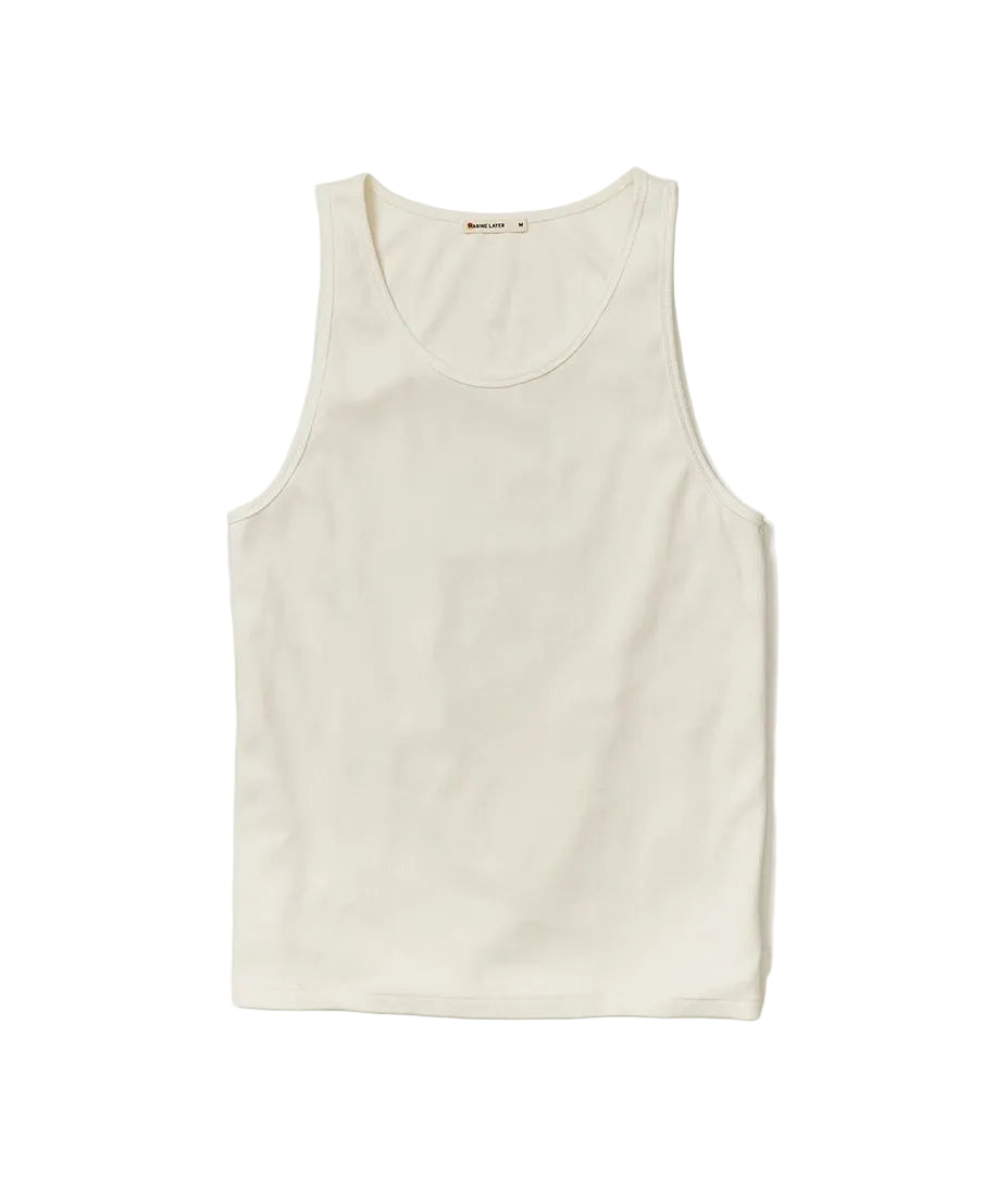 Men’s white ribbed tank top laid flat showing shape and construction